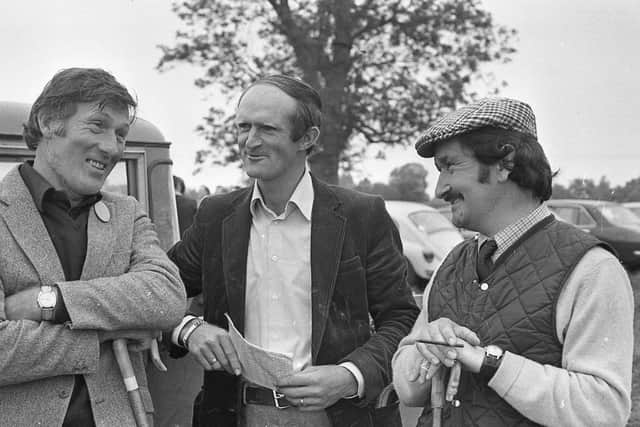 Sizing up their chances of a win while they wait their turn to compete as the sheepdog trials at Shane’s Castle, Antrim, in August 1981 are, from left, Caldwell Hampbell, Castlederg, Thomas McVeigh, Saintfield, and George Harper, Castlerock. Picture: News Letter archives