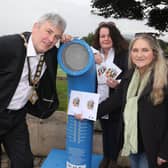 The Mayor of Causeway Coast and Glens Borough Council Councillor Richard Holmes enjoys the Poetry Jukebox at Ballycastle seafront with the Desima Connolly from Causeway Coast and Glens Borough Council’s Arts team and Maria McManus from Poetry Ireland