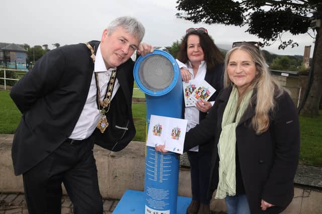 The Mayor of Causeway Coast and Glens Borough Council Councillor Richard Holmes enjoys the Poetry Jukebox at Ballycastle seafront with the Desima Connolly from Causeway Coast and Glens Borough Council’s Arts team and Maria McManus from Poetry Ireland