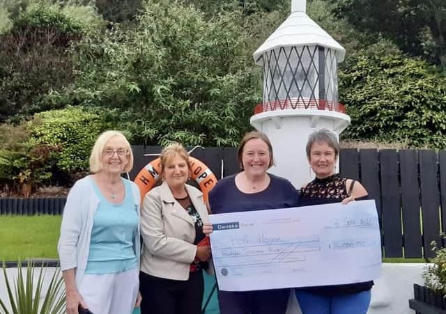 Liz McCaffrey, Heather Garrett, LeeAnn Clarke and Karen McMeekan presenting the 1in3 cheque at Hope House.