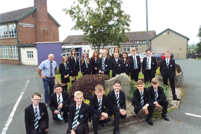 Mr Robinson (Senior Teacher and Year 8 Tutor) with some of the new Year 8 pupils outside the school building