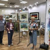 Pictured in the Ballymena Vis Art Exhibition and Pop Up Shop in The Tower Centre, Ballymena, are - Vis Art members Stephen Brown, Catherine Flood (President) and Maria Hunter