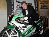 Bob Mullan with the 125cc PJ O'Kane Honda raced by Robert Dunlop that he bought during a tribute night held in memory of the Ballymoney road racing legend in 2008.
