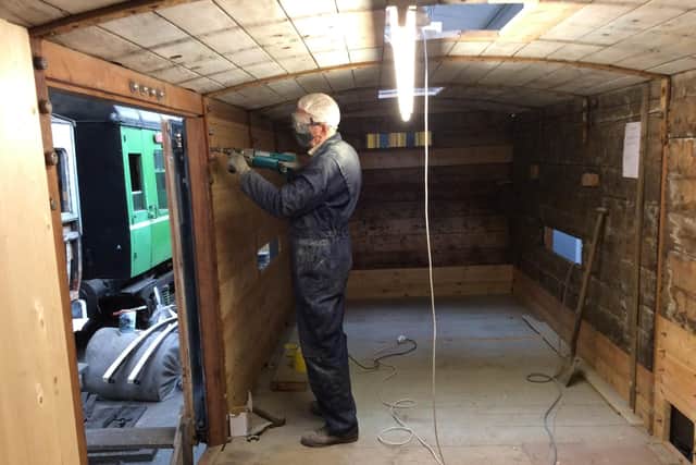 John White at work on the interior of the van.