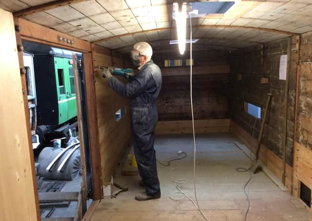 John White at work on the interior of the van.