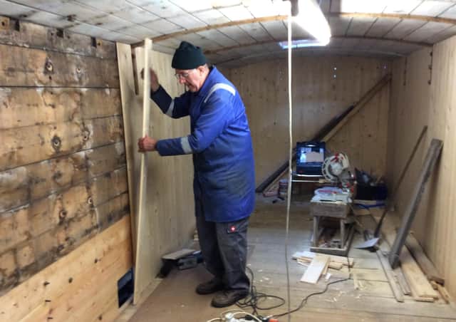 Bob Edwards, RPSI volunteer, working on the restoration of the van.