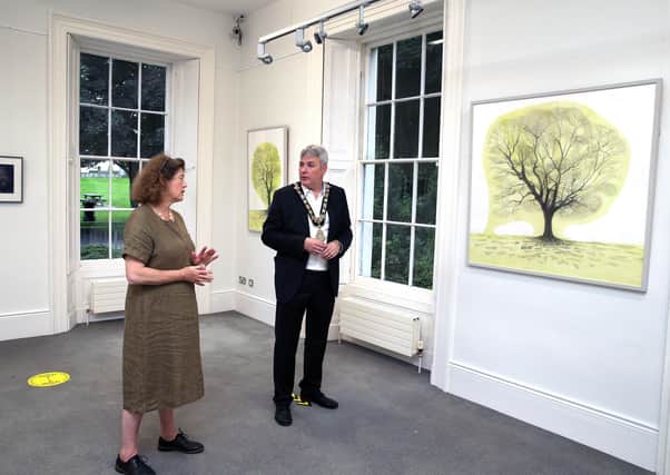 Katie English pictured at Flowerfield Arts Centre where her new exhibition is on display with the Mayor of Causeway Coast and Glens Borough Council Councillor Richard Holmes