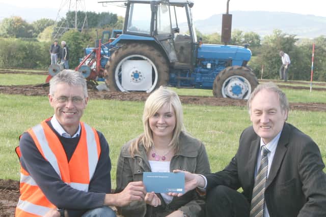 John Taggart from Northern Bank presents sponsorship to Tom and Rachel Cross at the Kilroot Ploughing Society’s centenary match in September 2007