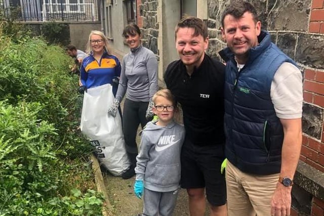 Principal Robert Dinsmore (right) with parents and pupils who took part in the community gardening event