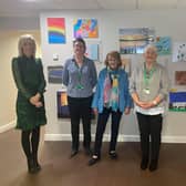 Upper Bann MP Carla Lockhart with her DUP party colleague Cllr Margaret Tinsley at with some NSPCC staff who work at the Craigavon centre. It is due to close at the end of October.