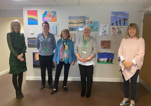 Upper Bann MP Carla Lockhart with her DUP party colleague Cllr Margaret Tinsley at with some NSPCC staff who work at the Craigavon centre. It is due to close at the end of October.