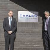 Pictured with Economy Minister Gordon Lyons are Philip McBride, managing director, and David Gilleece, operations director, Thales Belfast