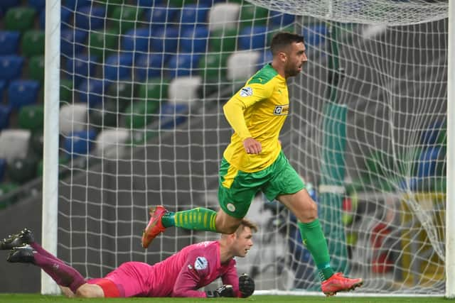 Joe Gormley heads off to celebrate finding the net last night for Cliftonville in a 1-1 draw with Linfield. Pic by PressEye Ltd.