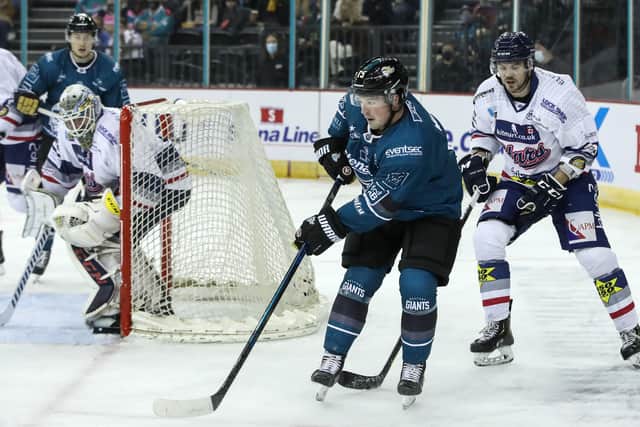 Belfast Giants' Darcy Murphy with Dundee Stars' Adam Morrison during Friday night's EIHL Challenge Cup game at the SSE Arena, Belfast. Picture: William Cherry/Presseye