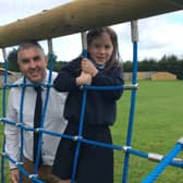 Eva Gordon from Clough Primary School, runner-up in the foundation
category of the 2021 'Dig in! to 10 years of Open Farm Weekend' schools' competition pictured with Principal, Ivor Hutchinson.