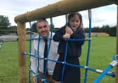 Eva Gordon from Clough Primary School, runner-up in the foundation
category of the 2021 'Dig in! to 10 years of Open Farm Weekend' schools' competition pictured with Principal, Ivor Hutchinson.
