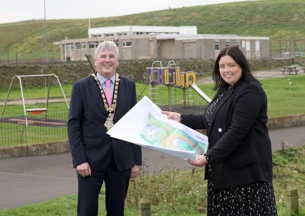 Communities Minister Deirdre Hargey and the Mayor of Causeway Coast and Glens Borough Council, Councillor Richard Holmes are pictured at the old recreation ground site at Ramore Avenue in Portrush