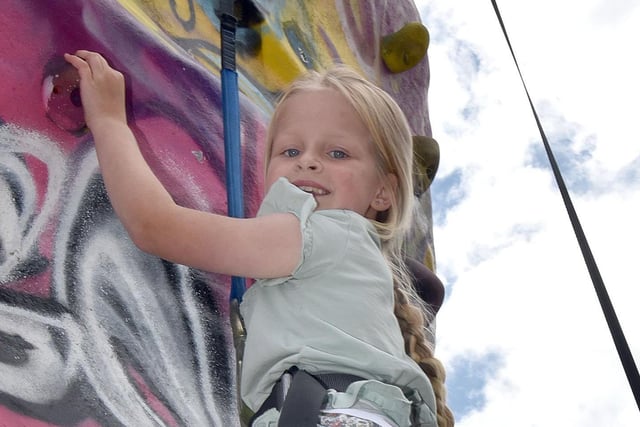 Molly-Rose Parkes was going up in the World at the ABC Council Fun Day as she negotiated the climbing wall. PT32-214.