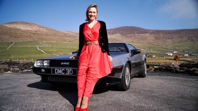Vicki Butler-Henderson with a DeLorean. Picture: WISER FILMS