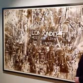 Internationally renowned photographer Victor Sloan with one of his many works on display currently at the Ulster Museum in Belfast.