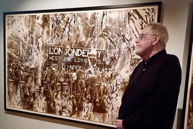 Internationally renowned photographer Victor Sloan with one of his many works on display currently at the Ulster Museum in Belfast.