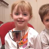 Holding the Challinge Cup is  Caitlin Caldwell and runners-up medal Cormac Carr at Portstewart Music Festival back in May 2009
