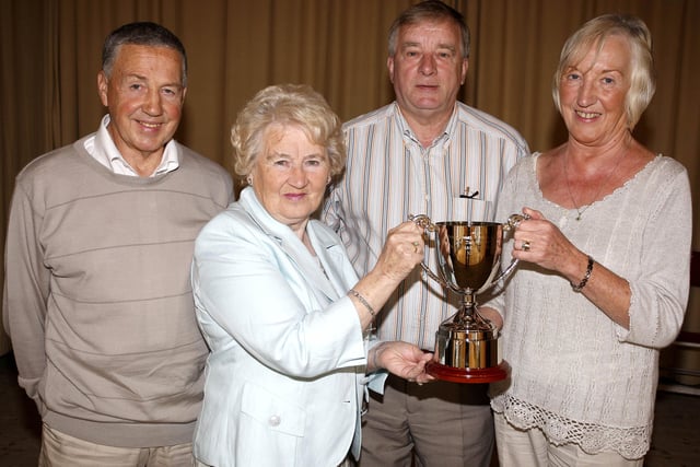 Joan Bell, Portstewart Music Festival president, is presented with the Margaret McNeill Memorial Challenge Cup from Norline Wilson, Margaret's sister. Included are, Billy Wilson and Tom McNeill back in 2009
