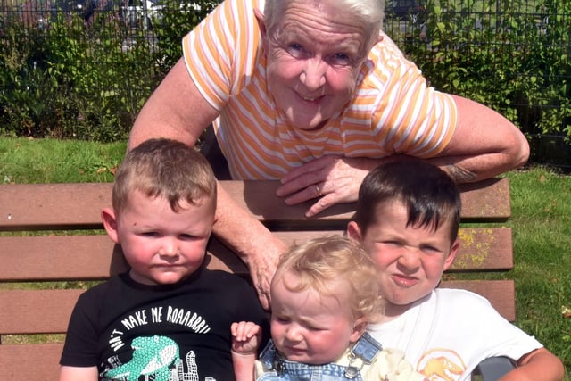 Enjoying the sunny weather at Portadown People's Park playground are Ann Kofa and grandchildren, Tiernan (5) and Nisha (10 months) and friend Archie (3). PT32-222.