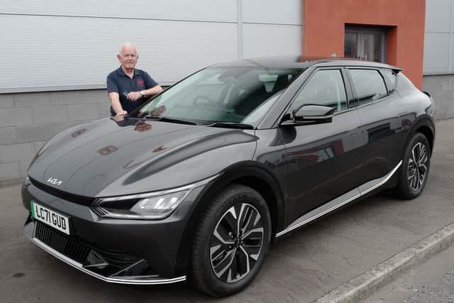 Portadown native Ian Lynas with the  new Kia EV6 he is test driving. Ian, a motoring correspondent for more than 30 years, has test drove several Electric Vehicles and shares his issues with charging ports or lack of them across the Portadown, Lurgan and Craigavon area and indeed across the whole of Northern Ireland.