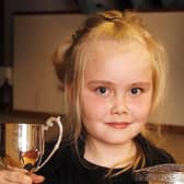 Hannah Glass proudly shows the two cups she won during the Coleraine Music Festival in April 2010