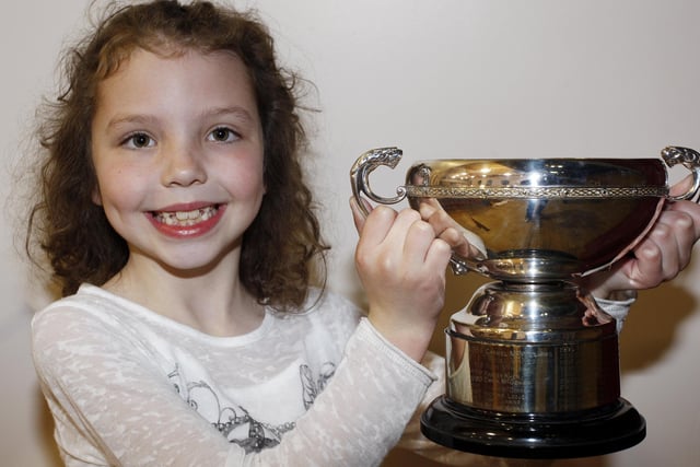 Emily Brown is all smiles with her cup at Coleraine Music Festival in April 2010