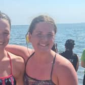 Talented sisters: Jessika is pictured with sister Holly. The sisters both swam in a race from Rostrevor to Warrenpoint, on Saturday, just two days after Jessika's big swim. Jessika won first female skins and Holly won second junior female skins.
