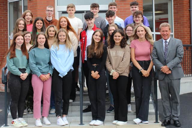 Successful A Level pupils from Rainey Endowed School in Magherafelt pictured withe headmaster Mr Neil McClements.