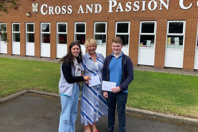 Top achieving girl Hannah McAuley (four As) and top boy Ronan Mateer (three As) pictured with Mrs Duffy