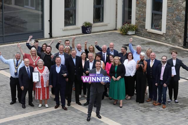 Coleraine retailers, along with the Mayor of Causeway Coast and Glens Borough Council Councillor Ivor Wallace, celebrate their joint win of High Street of the Year at the High Street Heroes Awards