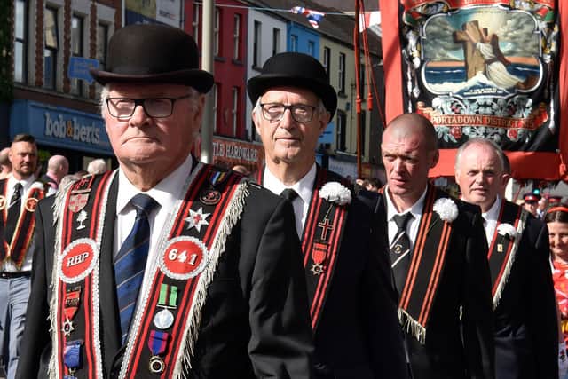 Members of the Royal Black Institution step out in Portadown on July 13. PT29-217.