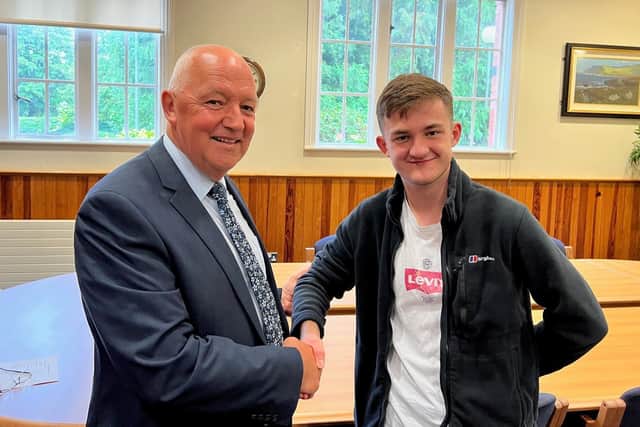 Headmaster of Lurgan College, Mr Trevor Robinson congratulates one of the pupils, Patrick Wilkinson, who received 4 A (including 2 A*) grades at A Level.