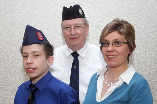 L/Cpl David McMullan of 1st Ballymoney BB pictured receiving his President's Badge from his Mum Noleen in 2010t. Looking on is Cpt Jim Graham. Not included is L/Cpl Philip Taylor, who also received his Badge