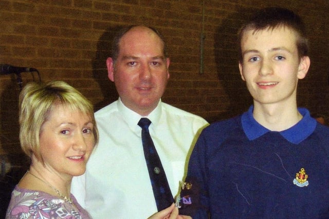 Gareth Fall, a member of 3rd Ballymoney BB (Church of God), pictured at their recent annual Inspection & Display receiving the Presidents Badge from his Mum Amanda with Captain Colin Owens looking on back in 2010