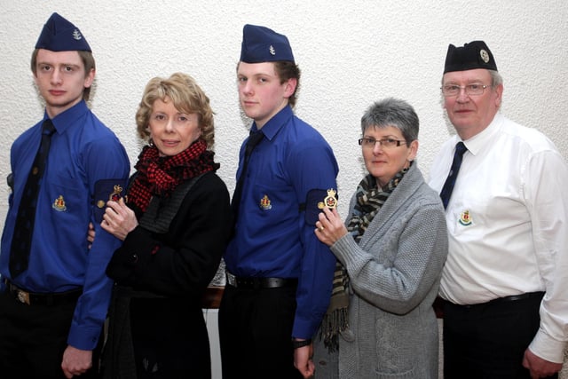 Two members of First Ballymoney BB S/Sgt Simon Beverland and S/Sgt Colin Browne, pictured in 2010  receiving their Queen's Badge from their respective Mums. Amanda and Sylvia. Included is Cpt Jim Graham. Missing from the picture is Sgt Niall Irwin, who also received his Badge