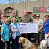 From left -  Barbara White, June Cherry, Josie McCormick & Thunder, Terry Hassan, Brian Doherty, Corinne Doherty and Anne McKeown & Flossie, who recently gathered to celebrate a £5,361.00 total raised by Brian on behalf of Guide Dogs NI.