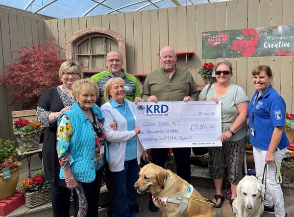 From left -  Barbara White, June Cherry, Josie McCormick & Thunder, Terry Hassan, Brian Doherty, Corinne Doherty and Anne McKeown & Flossie, who recently gathered to celebrate a £5,361.00 total raised by Brian on behalf of Guide Dogs NI.