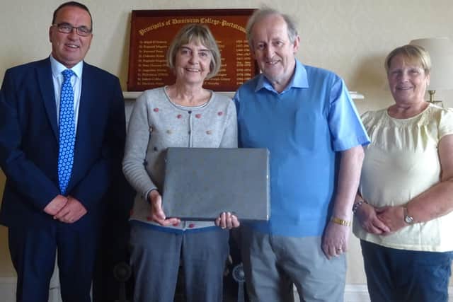 Ms Ronan being presented with gifts from Mr Michael FlemingChairperson of the Board of Governors. From left - G Lynch ( New Principal) , R Ronan, M Fleming , E Fleming