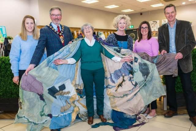 Mid and East Antrim Borough Councillor William McCaughey and Causeway Coast and Glens Heritage Trust Staff with Portrush storyteller Kate Murphy