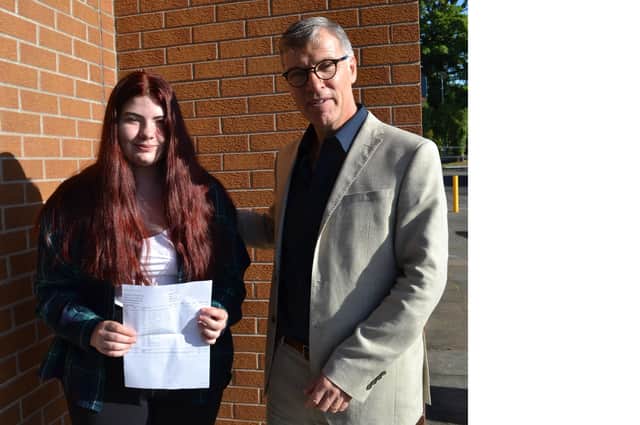 Mr J Martin congratulates Cara Decodts who achieved an A star, 5As, and a B and C star at GCSE