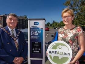 Mayor of Mid and East Antrim, Alderman Noel Williams and Elaine Smith Council's Climate and Sustainability Manager at one of the electric vehicle charge points in Larne.