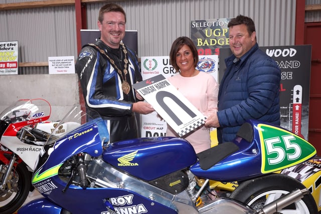 Mayor of Lisburn and Castlereagh City Council, Councillor Scott Carson pictured with Kerry Lindsay, wife of the late Darran Lindsay, and James Courtney of the Dundrod and District Motorcycle Club during the Ulster Grand Prix Centenary Day.
PICTURE BY STEPHEN DAVISON