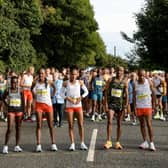 Elite runners take their place before the start of the event on Sunday.