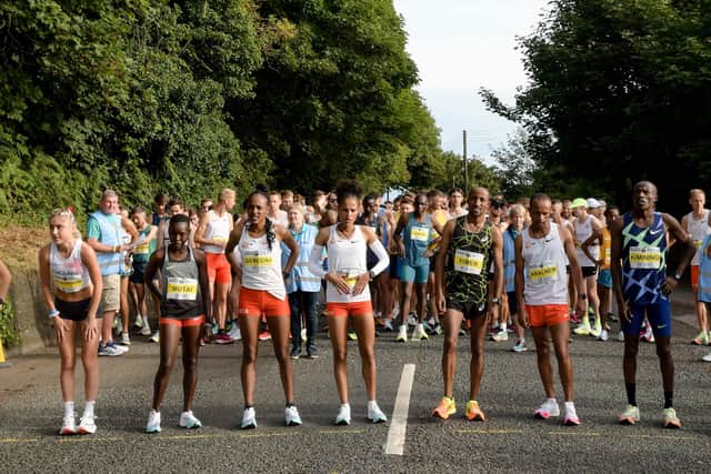 Elite runners take their place before the start of the event on Sunday.