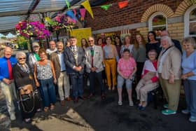 Project participants on the railway platform at Whitehead Railway Museum - one of the project sites - with Mr Mukesh Sharma, Chairman of the Northern Ireland Committee of the National Lottery Fund.